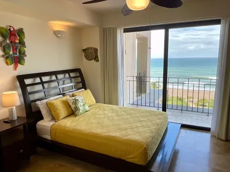 Breathtaking ocean views from every room in this 2-bedroom beachfront condo