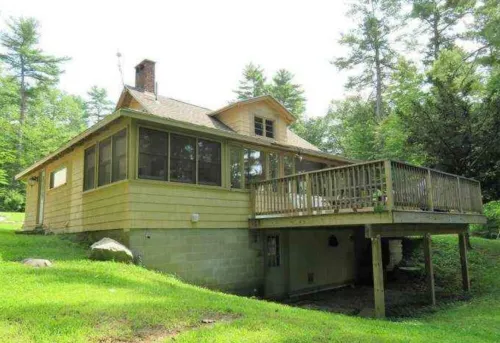 5 bed 4 bath in the Basin of Sebago Lake with 200 ft. of shared beach frontage