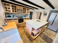 Charming  Listed Thatched Cottage with parking and short walk to sandy beach .
