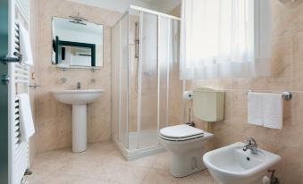 a modern bathroom with beige walls , white fixtures , and a large window , including a toilet , sink , and shower at Hotel Centrale