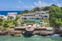 Gorgeous Beach House Perched Right Over the Ocean Hotels in 