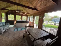 Lovely home near beaches. Ample yard with patio with enclosed porch & hot tub.