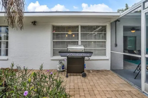 1 Mile to Beach! Tropical Getaway Home w/ Pool & Grill