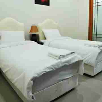 โรงแรมควีนพาเลส Rooms