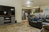 Spacious Entertainment Hub and Enclosed Deck - Cozy Forest Retreat