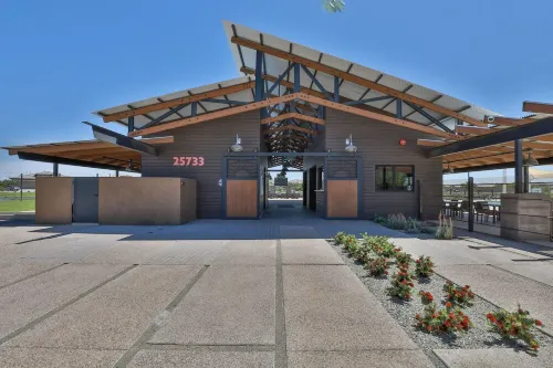 New 4 BR home with garage, pool, play area, splash pads, fenced backyard