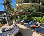 Oceanfront condo on the beach w/ hot tub! Minutes walk to restaurants and bars!