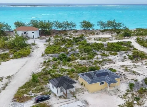 Newly Built 2-Bedroom Villa Short Walk From Beach & Minutes away from Airport!