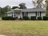 Charming house with a large fenced lot in a central location