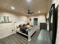 TAKE IT EASY Fishing Cabin. Large enclosed bay for storing the boat.