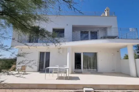 Seafront Juniper apartment with large veranda, 20m from the crystal clear sea.