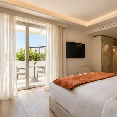 Santorini Heart Hotel & Spa Hotels near Three Bells of Fira
