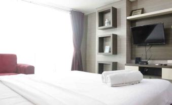 Prime and Comfy Studio at Tamansari la Grande Apartment by Travelio