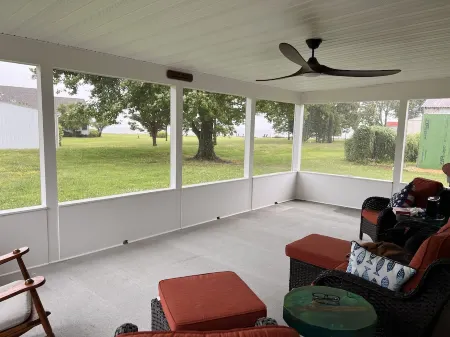 Single family home with screened porch.