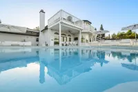 Inspired by the iconic white buildings and turquoise waters of Greece.
