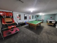 Spacious 4-bedroom house on 1 acre, fenced, GAME ROOM, and party tent rental!