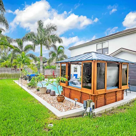 Urban Oasis W/Hot Tub, Heated Pool and Private Movie Theater 2 Bedroom Home by RedAwning