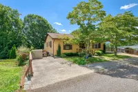 Lower-level lake retreat with mountain views, pool, central AC, deck, grill