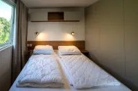 Chalet in Oostkapelle with Tennis Court Hotels near Restaurant Dennenbos