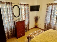 A colored beacon sitting on the hill side road that leads into Sandy Ground, Hotels in Sandy Ground