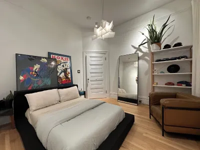 Mission jewel box filled with art and classic furniture, Garage parking & AC Hotel a Mission District