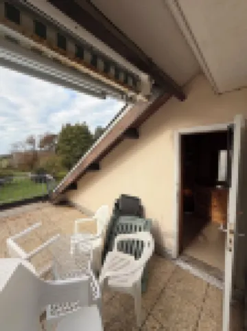 Apartment with beautiful view over a wooded park and a large terrace