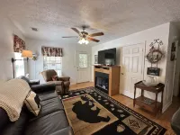 Downtown by Chattahoochee River, sit on front porch as horse and buggy stroll by