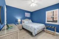 Beach Getaway - First floor unit with Pool and beach access steps away!