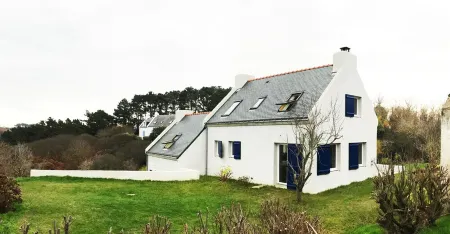 House on the wild coast of beautiful island at sea