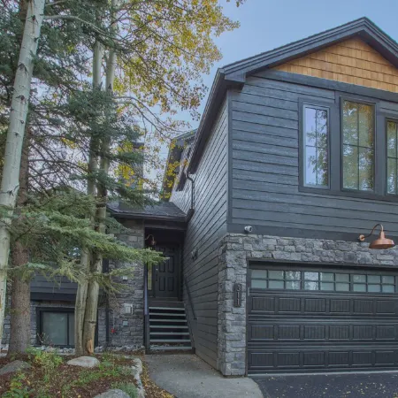 Dreamy home on river, mountain views, steps from town.
