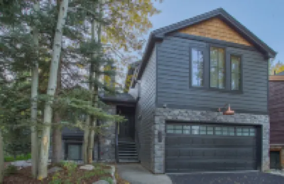 Dreamy home on river, mountain views, steps from town.