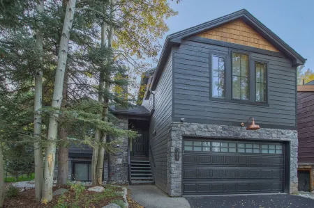 Dreamy home on river, mountain views, steps from town.