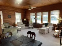 Sunny cottage built over the water on the St. Lawrence River