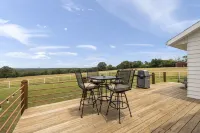 Lake view house with expansive views, fireplace, walk in showers, Ember mugs.