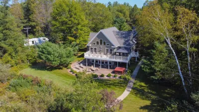 "Home Away From Home" nestled into five private acres on an all sports lake!