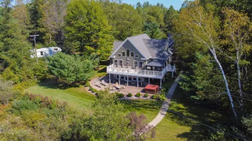 "Home Away From Home" nestled into five private acres on an all sports lake!