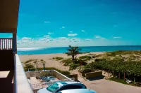 BEACHFRONT COMPLEX! STEPS FROM THE OCEAN!  HEATED POOL FULL KITCHEN FREE PARKING