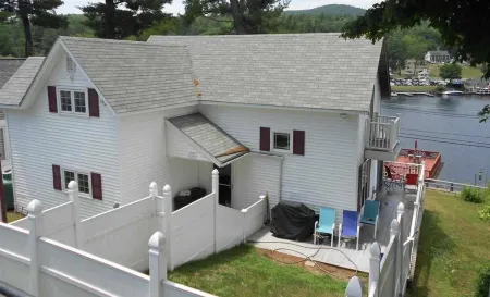 Winnipesaukee lakefront house includes slip, deck, hot tub & sleeps up to 11