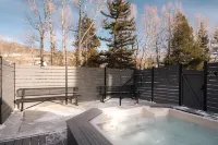 Scenic Patio with River View and Hot Tub - Cozy Mountain Retreat