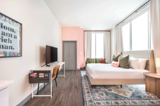 Floor-to-Ceiling Windows and Full Kitchen Amenities - Bold Chic