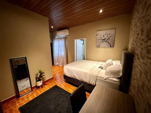 Cozy San Pedro Sula apartment with WiFi, AC, full kitchen, and comfy living room