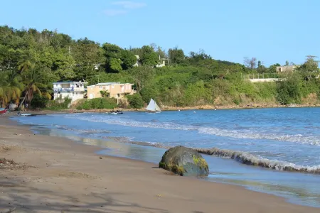 Steps away from a soft sand beach and warm waters