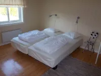 Outdoor place with furniture and barbeque, boat in lake Hotels in Nassjo