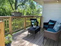 Cheerful two bedroom home in quiet neighborhood. Sun Porch ~ Patio ~  Large yard