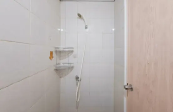 Basic Studio Apartment near KRL Station at Poris 88 By Travelio