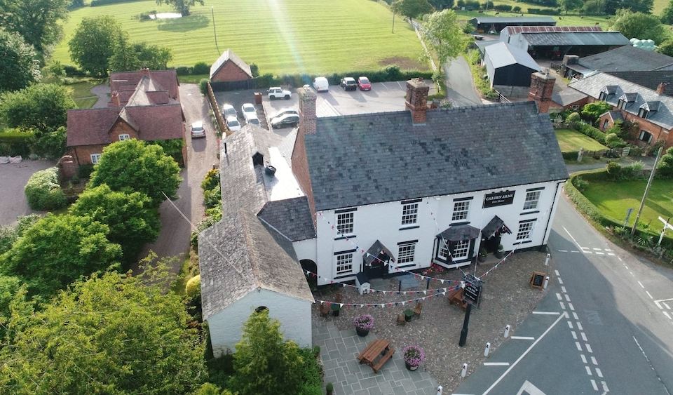 a bird 's eye view of a town with a white building and a parking lot at The Carden Arms