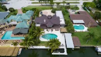 Coco Sands Riverfront Pool Home w/5 Bedrms - 3 min to the beach - مسبح خاص