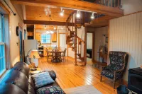 Charming 2-bedroom cottage with loft, AC, and WiFi on peaceful 295-acre property