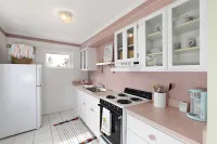 The Pink House Unit B: A Cozy Retreat Steps from the Beach