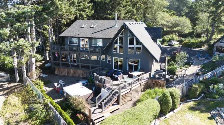 Large beach home with fantastic views of the Oregon Coast with a quaint cabin.